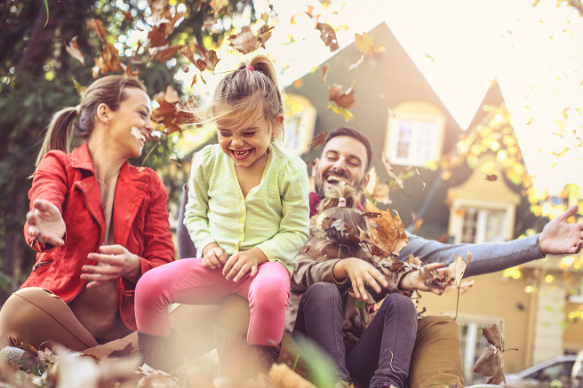 family outside of home playing